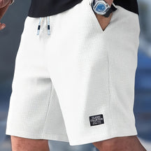 Calções Casuais Masculinos com Textura, Cintura com Cordão, Tecido Leve de Poliéster, Bolsos para Uso Diário, Praia ou Atividades ao Ar Livre | Calções com Cordão | Calções Leves